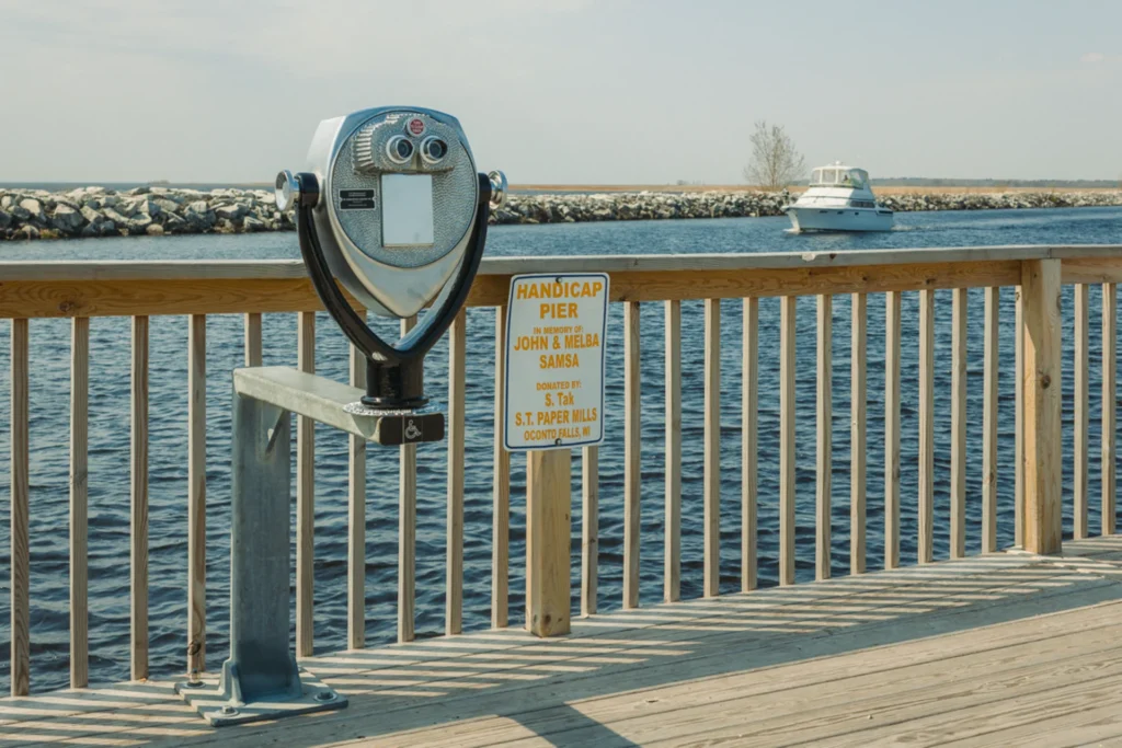 View of ADA-accessible bases Tower Optical coin-operated binocular viewer looking across the water
